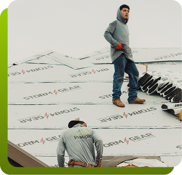 two men working on a roof
